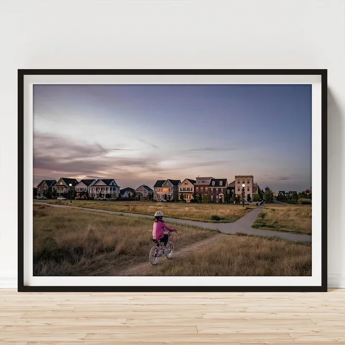 Young Girl Bikes On A Park Dirt Path On The Edge Of A Neighborhood Art Print